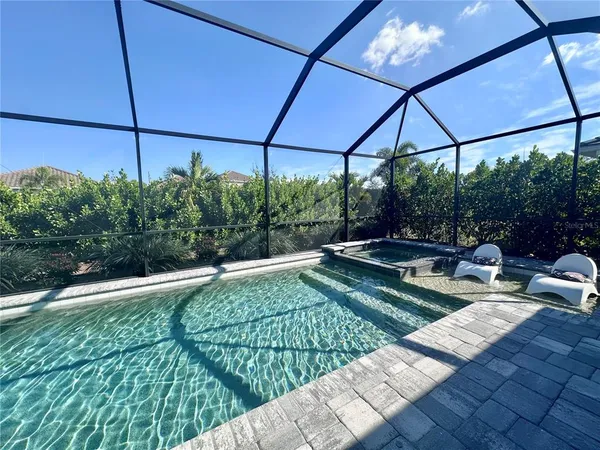 a view of a chairs and table in the patio