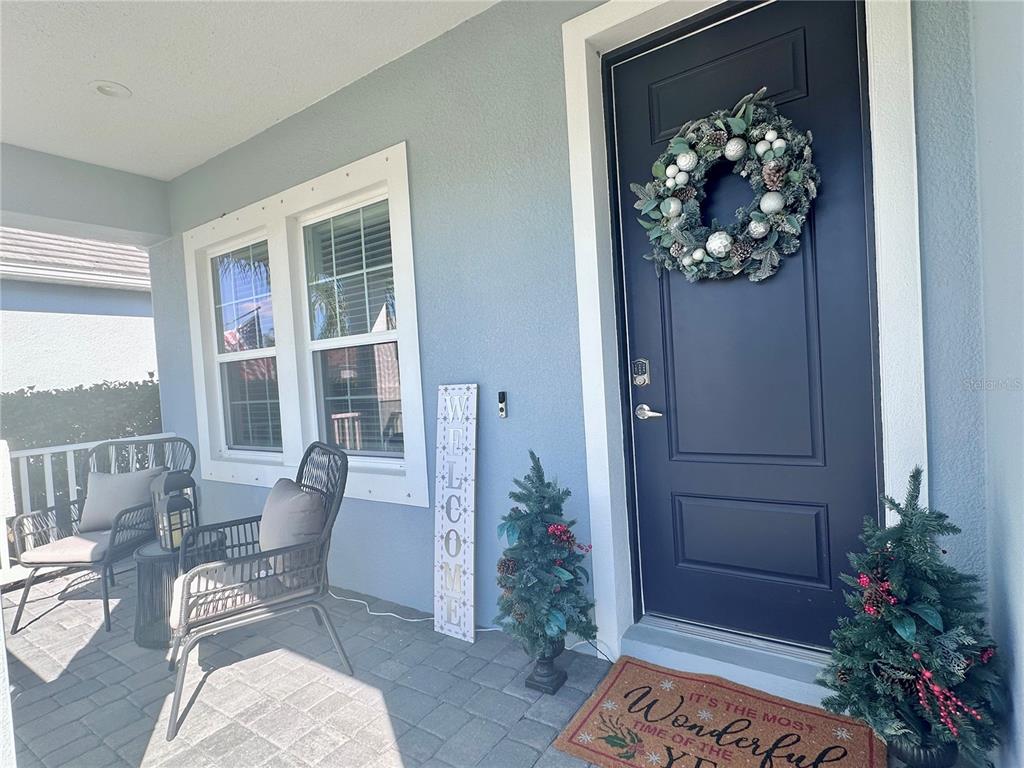 2716 Butterfly Jasmine Trail Sarasota, FL 34240 - Photo 2 of 27 a living room with furniture and flowers
