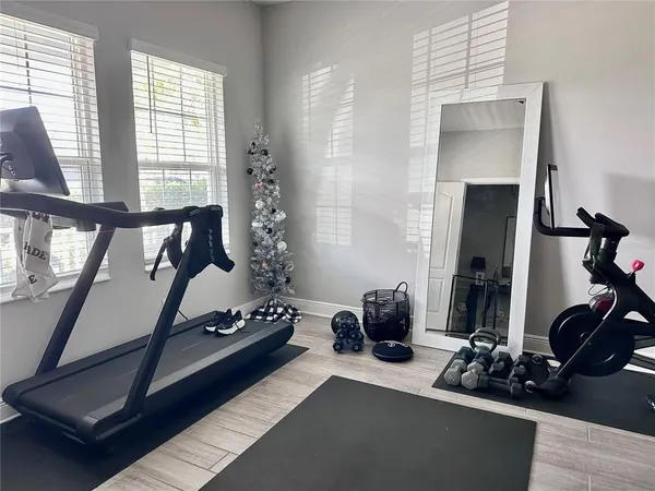 a bedroom with furniture and a window