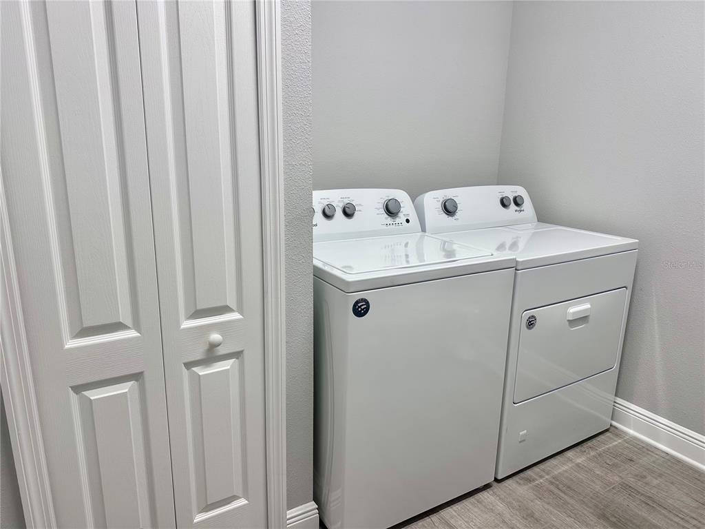 2716 Butterfly Jasmine Trail Sarasota, FL 34240 - Photo 27 of 27 a utility room with dryer and washer