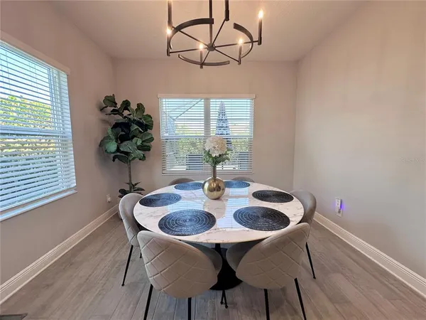a view of a dining room with furniture window and outside view