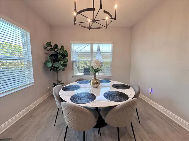 a view of a dining room with furniture window and outside view