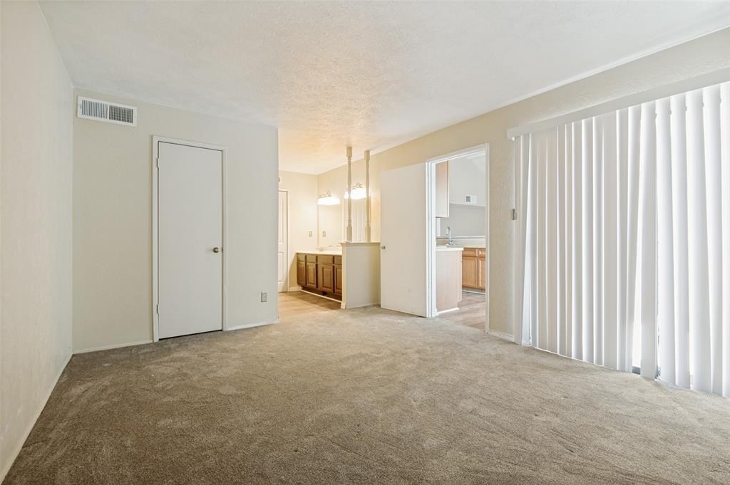 7305 Pineberry Road Dallas, TX 75249 - Photo 18 of 25 a view of an empty room with a window