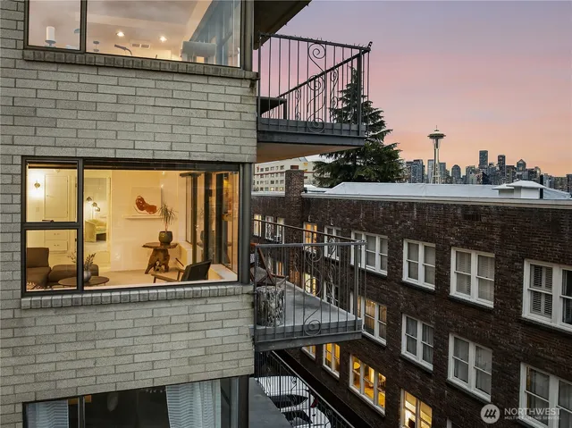 a view of a brick house with many windows