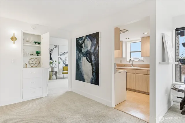 a view of a kitchen with refrigerator and stove