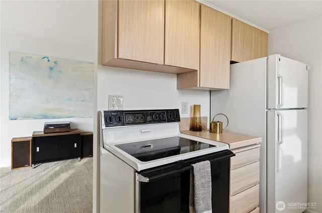 a kitchen with a sink cabinets and appliances