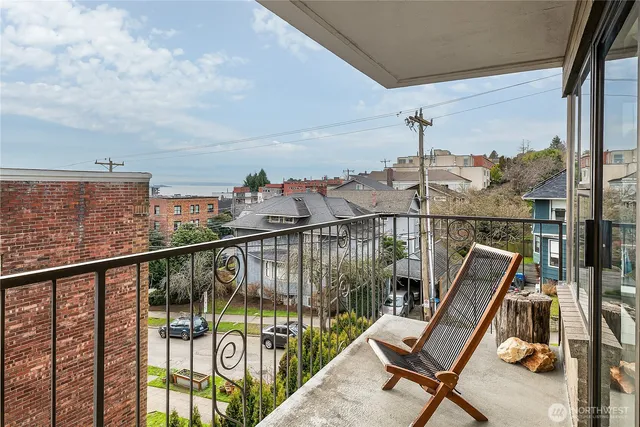 a view of a balcony with furniture