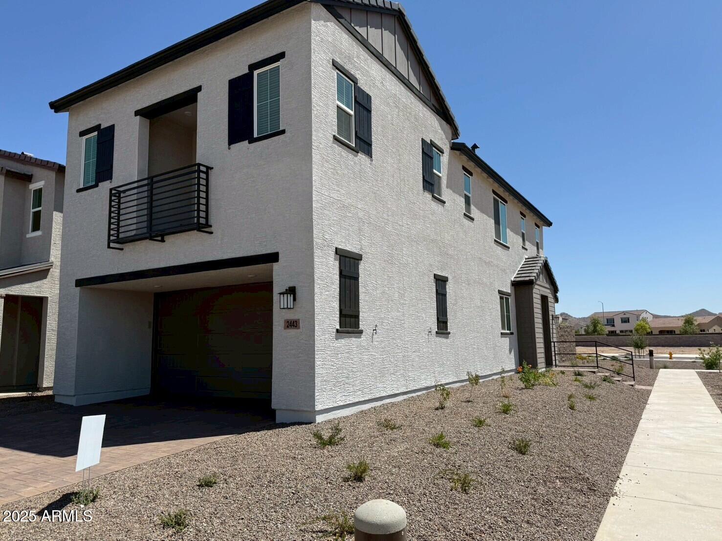 2443 West Rowel Road Phoenix, AZ 85085 - Photo 3 of 19 a view of a house with roof
