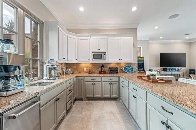 a bathroom with a shower a sink a mirror and shower