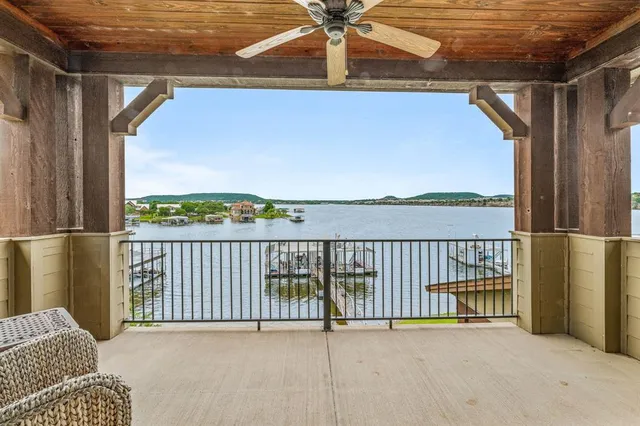 a view of a lake with boats in front of house