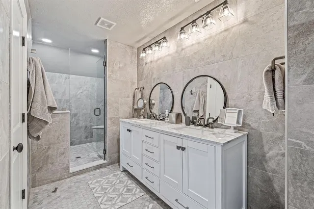 an aerial view of a house with a lake view