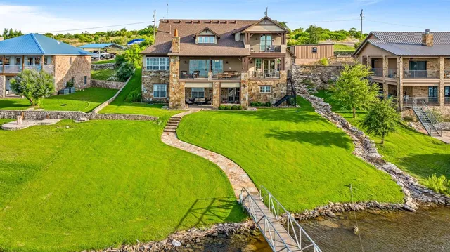 a living room with furniture a rug and a chandelier