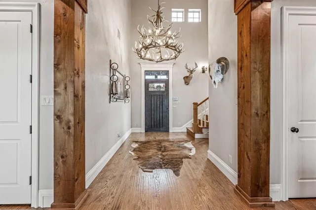 a large kitchen with stainless steel appliances granite countertop a stove a sink dishwasher and a wooden cabinets