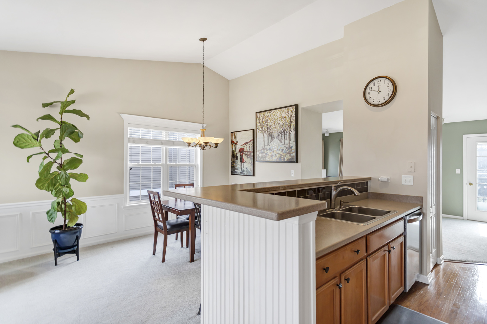 2574 Golf Ridge Circle Naperville, IL 60563 - Photo 15 of 29 a kitchen with a sink and a refrigerator