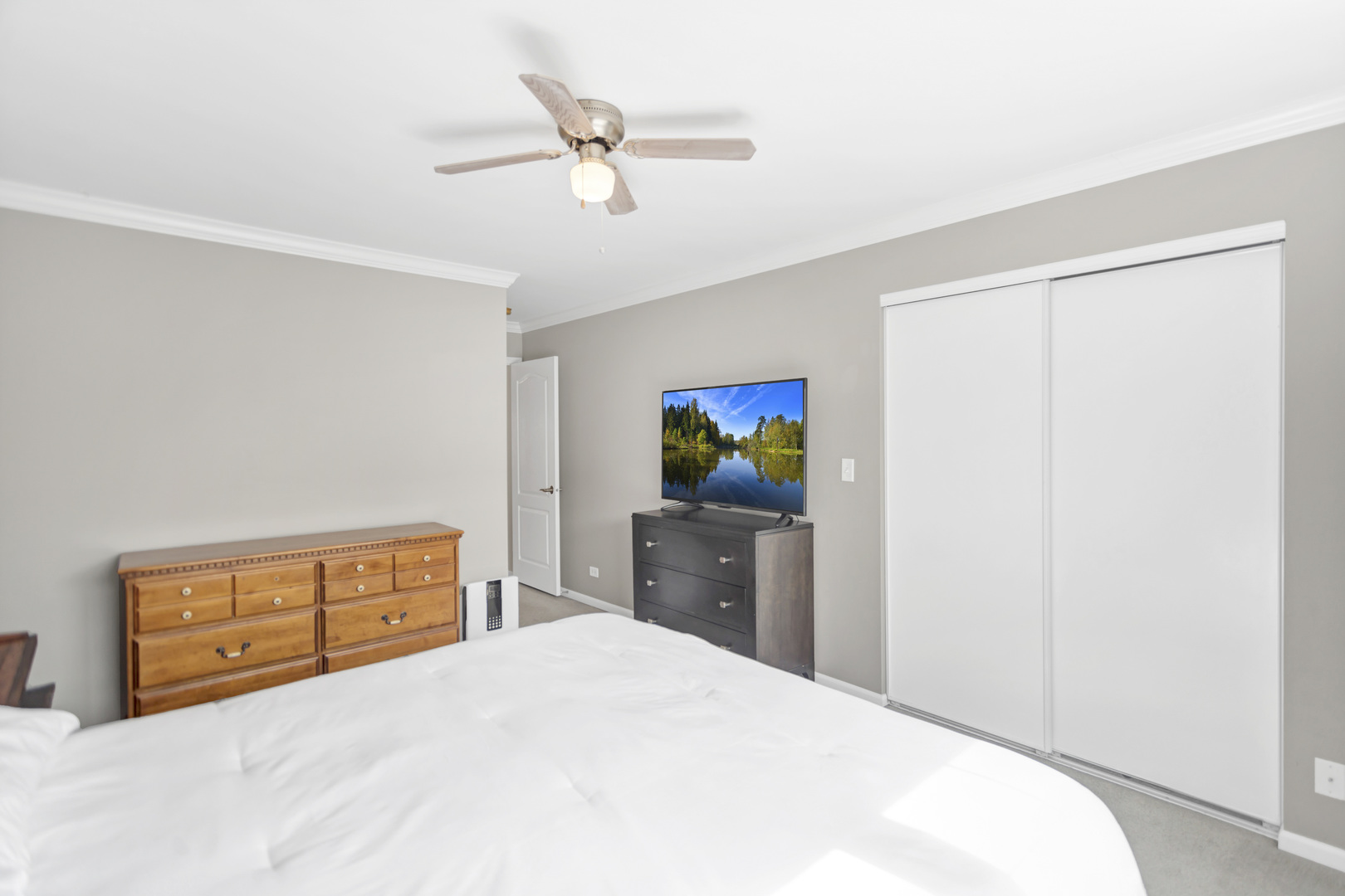 2574 Golf Ridge Circle Naperville, IL 60563 - Photo 22 of 29 a bedroom with a bed and a dresser