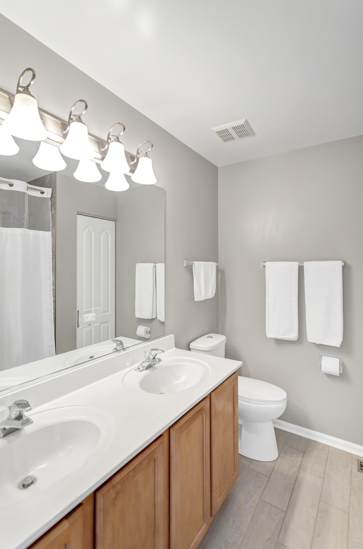 2574 Golf Ridge Circle Naperville, IL 60563 - Photo 24 of 29 a bathroom with a sink and a mirror