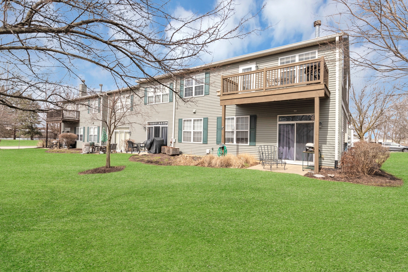 2574 Golf Ridge Circle Naperville, IL 60563 - Photo 4 of 29 a front view of a building with a garden