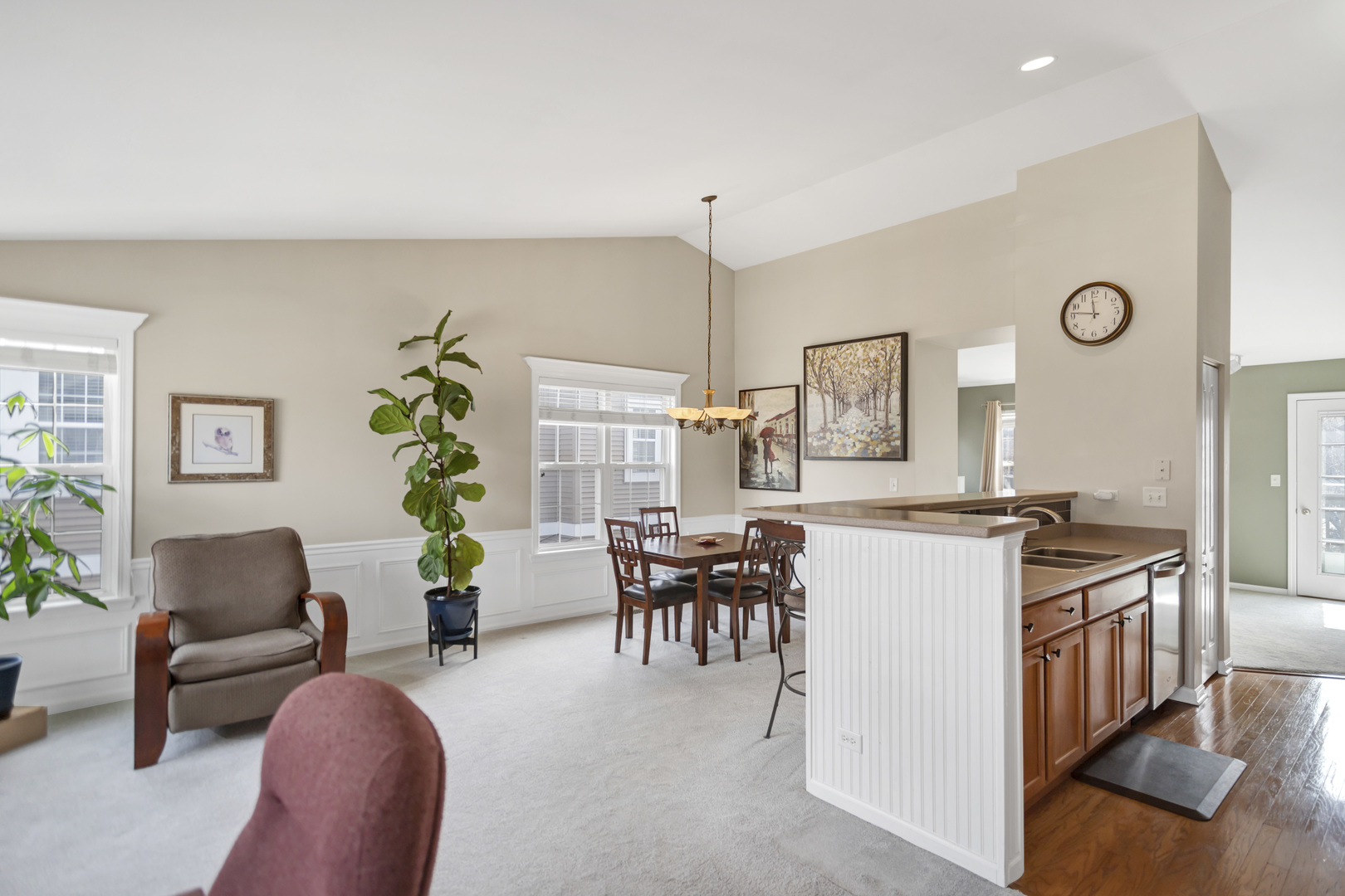 2574 Golf Ridge Circle Naperville, IL 60563 - Photo 8 of 29 a living room with furniture a dining table and a potted plant