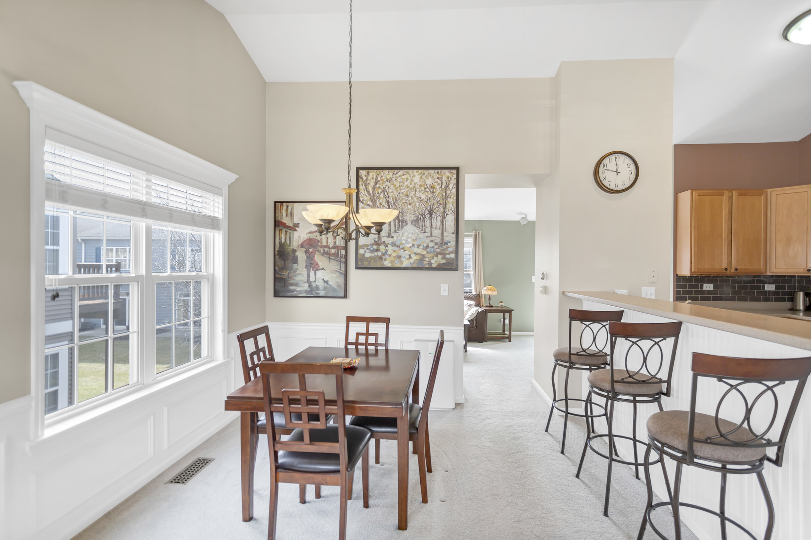 2574 Golf Ridge Circle Naperville, IL 60563 - Photo 10 of 29 a view of a dining room with furniture and a large window