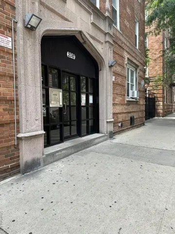 a view of a house with a parking space