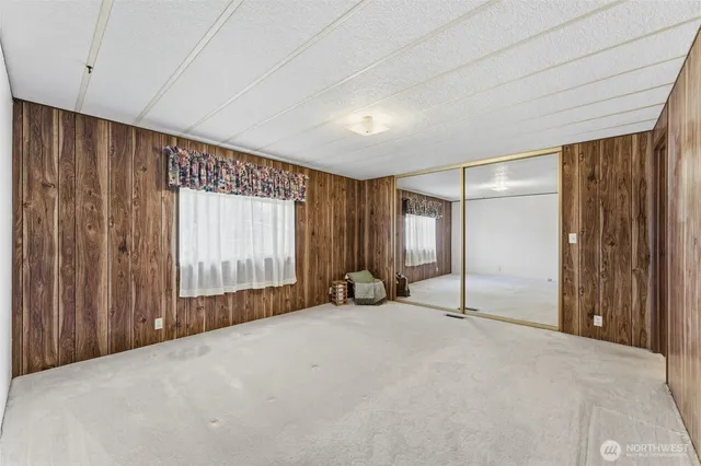 a view of an empty room with a sliding door