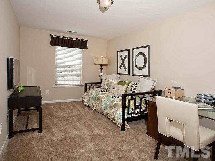 1020 Grand Ridge Drive Rolesville, NC 27571 - Photo 13 of 23 a bedroom with furniture and a window