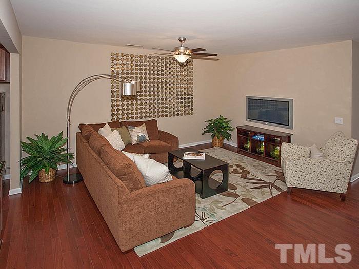 1020 Grand Ridge Drive Rolesville, NC 27571 - Photo 4 of 23 a living room with furniture and wooden floor