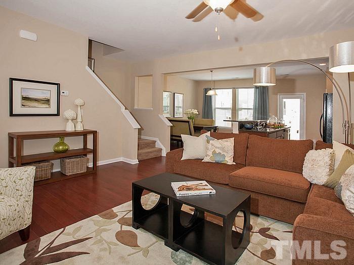 1020 Grand Ridge Drive Rolesville, NC 27571 - Photo 5 of 23 a living room with furniture and wooden floor