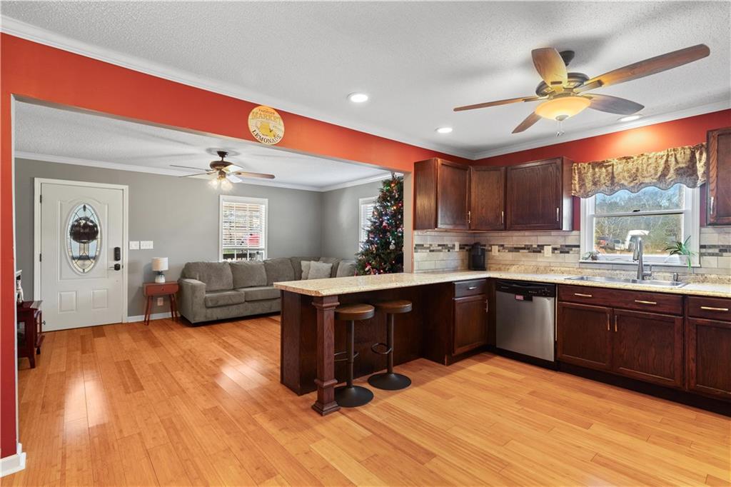 297 Tucker Hollow Road Southeast Calhoun, GA 30701 - Photo 13 of 42 a kitchen with a sink cabinets and window