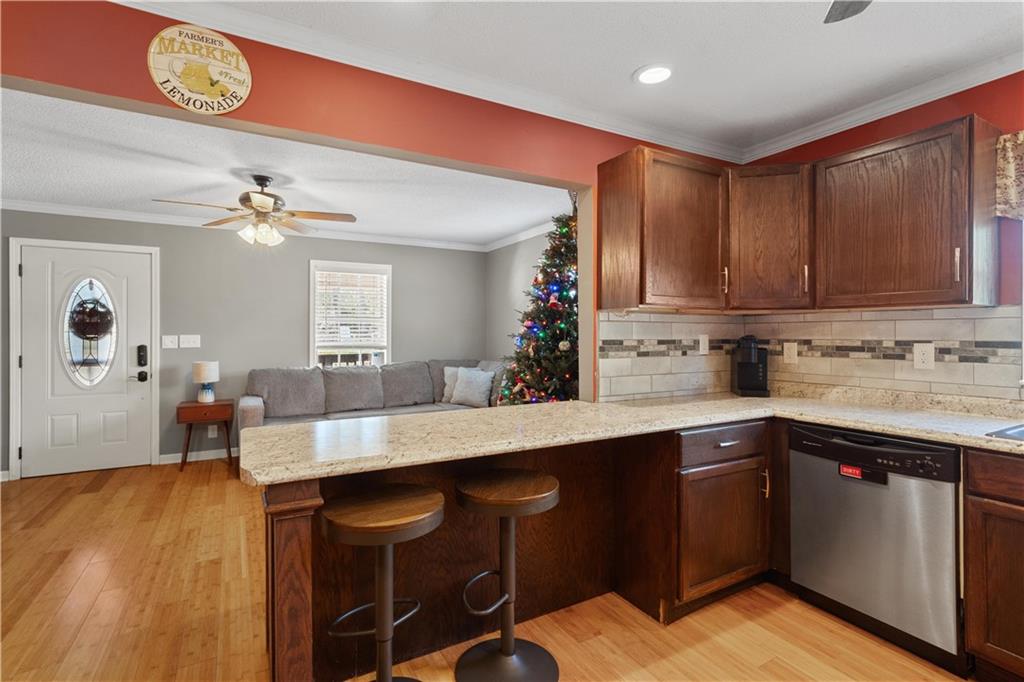 297 Tucker Hollow Road Southeast Calhoun, GA 30701 - Photo 14 of 42 a kitchen with a sink cabinets and wooden floor