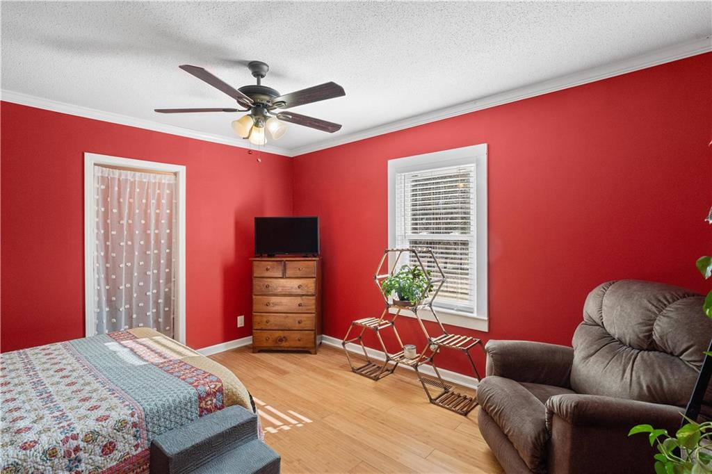 297 Tucker Hollow Road Southeast Calhoun, GA 30701 - Photo 23 of 42 a bedroom with a bed and a window
