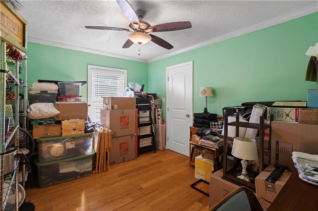 297 Tucker Hollow Road Southeast Calhoun, GA 30701 - Photo 26 of 42 a bed room with a bed furniture and a window