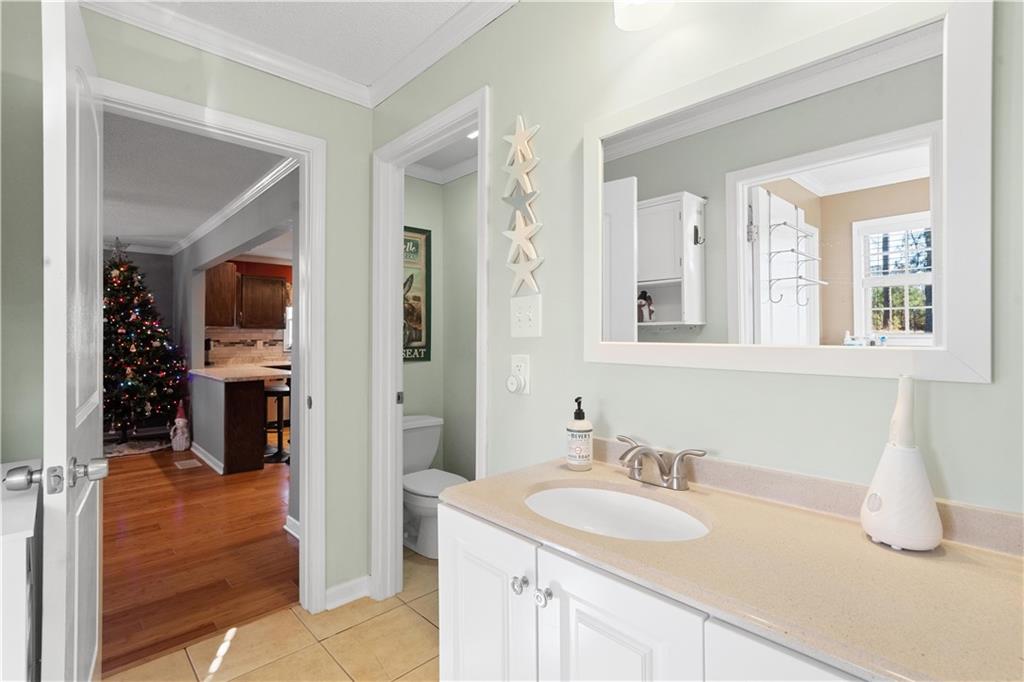 297 Tucker Hollow Road Southeast Calhoun, GA 30701 - Photo 28 of 42 a bathroom with a sink and a mirror