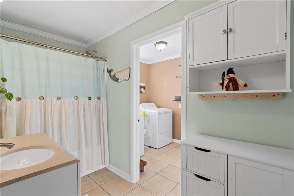 297 Tucker Hollow Road Southeast Calhoun, GA 30701 - Photo 29 of 42 a view of a bathroom with a sink and a mirror