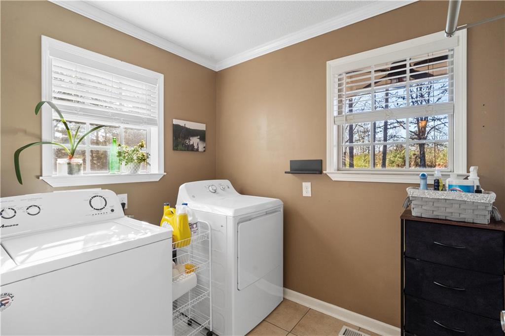 297 Tucker Hollow Road Southeast Calhoun, GA 30701 - Photo 30 of 42 a utility room with dryer and washer