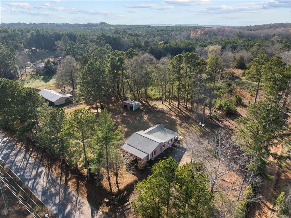 297 Tucker Hollow Road Southeast Calhoun, GA 30701 - Photo 38 of 42 an aerial view of a house with a yard