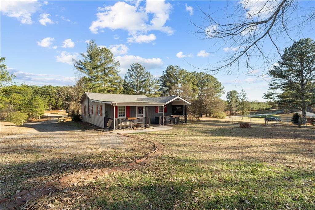 297 Tucker Hollow Road Southeast Calhoun, GA 30701 - Photo 4 of 42 a view of a house with a yard