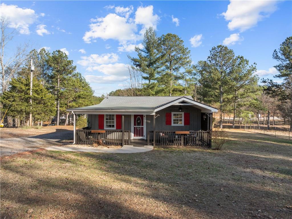 297 Tucker Hollow Road Southeast Calhoun, GA 30701 - Photo 42 of 42 a view of a house with a yard and large tree