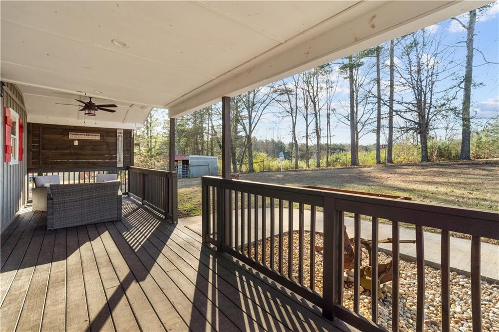 297 Tucker Hollow Road Southeast Calhoun, GA 30701 - Photo 7 of 42 a view of a balcony with wooden floor