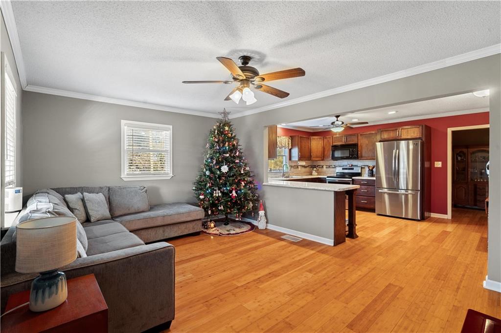 297 Tucker Hollow Road Southeast Calhoun, GA 30701 - Photo 9 of 42 a living room with furniture kitchen and a window