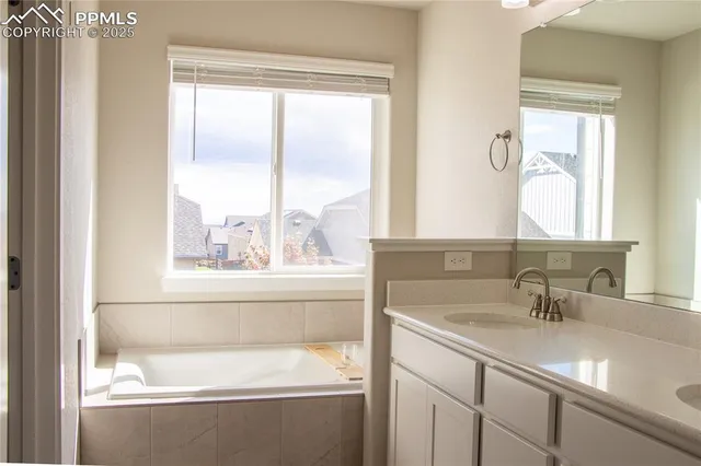 a bathroom with a granite countertop shower mirror and a sink