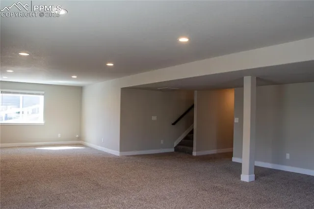 a bathroom with a granite countertop toilet and a shower