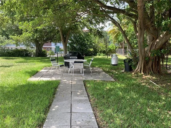 a view of a balcony with furniture