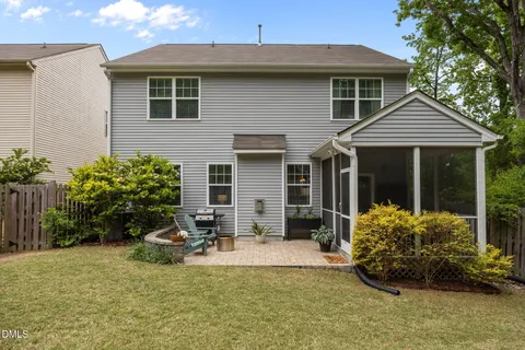 a front view of a house with yard and seating space