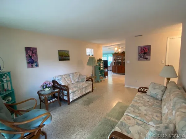 a living room with furniture and a couch