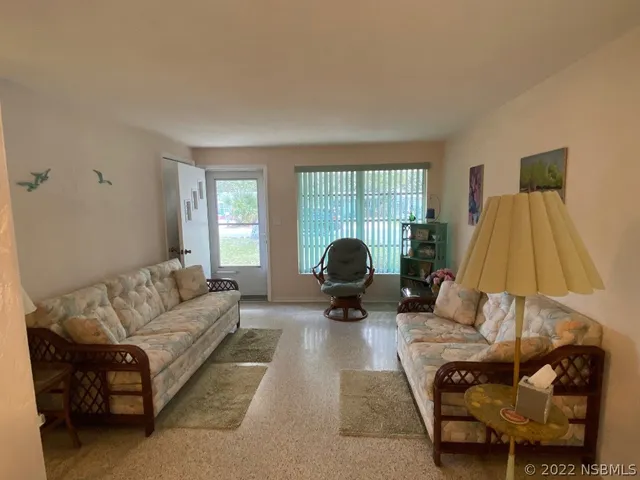 a living room with furniture and a couch