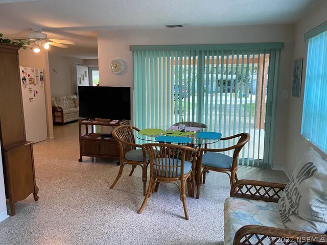 a workspace with furniture and a window