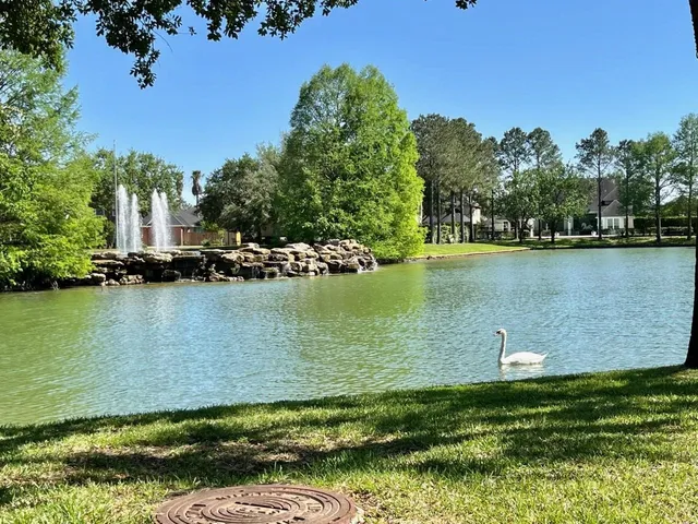 an aerial view of a houses with a lake view