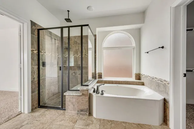 a spacious bathroom with a double vanity sink mirror and