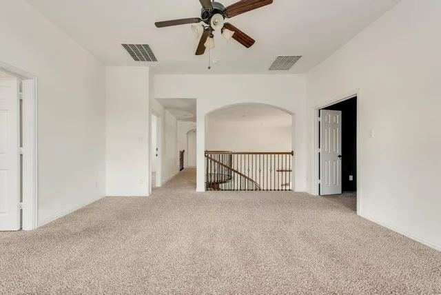 a view of a kitchen with a sink and a refrigerator